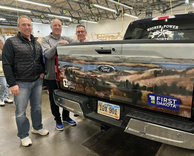 Tim stands with his new Ford 150 from First Dakota