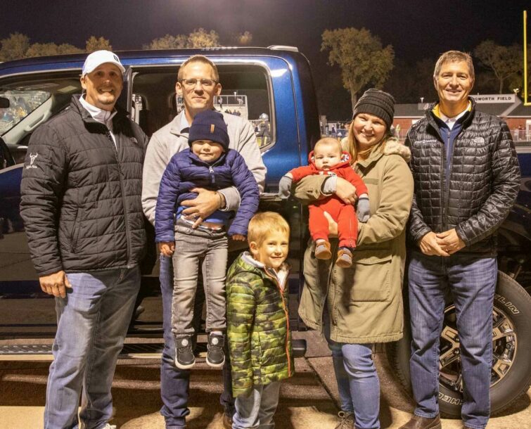 Jesse Bailey and Family in front of the truck they won