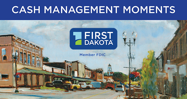 First dakota logo lays over a downtown scene with the words cash management moments
